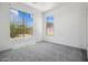 Bedroom with neutral carpet and natural light at 45647 W Starlight Dr, Maricopa, AZ 85139