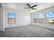 Spacious bedroom with large windows providing abundant natural light at 45647 W Starlight Dr, Maricopa, AZ 85139