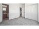Cozy bedroom with closet and entry to bathroom at 45647 W Starlight Dr, Maricopa, AZ 85139