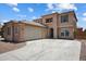 Stunning two-story home featuring a tile roof, spacious driveway, and attached two-car garage at 45647 W Starlight Dr, Maricopa, AZ 85139