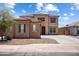 Charming two-story home featuring a tile roof, stucco exterior, and a well-maintained front yard at 45647 W Starlight Dr, Maricopa, AZ 85139