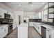 Contemporary kitchen with white cabinets, stainless appliances, and large island at 45647 W Starlight Dr, Maricopa, AZ 85139