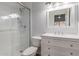 Bathroom featuring a glass shower, modern vanity, and good lighting at 4601 N 102Nd Ave # 1020, Phoenix, AZ 85037