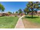 Well-maintained community pathway to swimming pool at 4601 N 102Nd Ave # 1020, Phoenix, AZ 85037