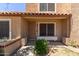 Inviting front entrance with a security door and covered porch, featuring tiled accents and desert landscaping at 4601 N 102Nd Ave # 1020, Phoenix, AZ 85037