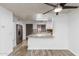 Open-concept kitchen featuring stainless steel appliances, granite counters, and a breakfast bar overlooking living area at 4601 N 102Nd Ave # 1020, Phoenix, AZ 85037
