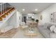 Bright living room featuring an open floor plan and staircase at 4601 N 102Nd Ave # 1020, Phoenix, AZ 85037