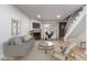Comfortable living room with fireplace and large window at 4601 N 102Nd Ave # 1020, Phoenix, AZ 85037