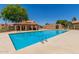 Community swimming pool with cabana, barbecue, and tanning area at 4601 N 102Nd Ave # 1020, Phoenix, AZ 85037