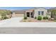 Charming single-story home featuring a well-maintained front yard and a neutral color scheme at 5139 N 185Th Ave, Litchfield Park, AZ 85340