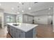 Spacious kitchen island featuring a stainless steel dishwasher and ample countertop space at 5139 N 185Th Ave, Litchfield Park, AZ 85340