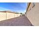 The house features a simple desert landscaped backyard with cinder block perimeter wall at 5316 N 186Th Dr, Litchfield Park, AZ 85340