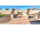 Beautiful brick-paved backyard area with outdoor grill and water feature, ideal for entertaining guests at 5316 N 186Th Dr, Litchfield Park, AZ 85340