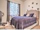 Comfortable bedroom with a bed, dark curtains, and decorative wall stars at 5316 N 186Th Dr, Litchfield Park, AZ 85340
