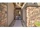The front gated entry features stone accents and stylish metalwork at 5316 N 186Th Dr, Litchfield Park, AZ 85340