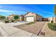 Front exterior view showcasing a well-maintained property with rock landscaping and curb appeal at 5316 N 186Th Dr, Litchfield Park, AZ 85340