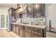 Stylish kitchen with granite countertops, stainless steel appliances, and tile backsplash at 5316 N 186Th Dr, Litchfield Park, AZ 85340