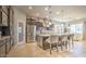 Modern kitchen with stainless steel appliances, an island, and pendant lighting at 5316 N 186Th Dr, Litchfield Park, AZ 85340