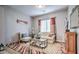 Bright living room with cozy seating, decorative fireplace, and stylish accents at 5316 N 186Th Dr, Litchfield Park, AZ 85340