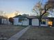 Charming single-story home features a neutral color scheme, small porch, and simple walkway at 6216 S 5Th Ave, Phoenix, AZ 85041