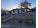 A well-maintained exterior with a simple landscape and a covered carport at 6216 S 5Th Ave, Phoenix, AZ 85041