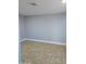 This is an empty room with neutral walls and flooring at 6216 S 5Th Ave, Phoenix, AZ 85041