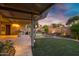 Enjoy the outdoor living space with a covered patio and artificial turf putting green at 645 W Longhorn Dr, Chandler, AZ 85286
