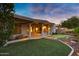 Relax with a covered patio overlooking the artificial turf putting green at 645 W Longhorn Dr, Chandler, AZ 85286