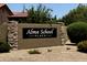 Stone sign for Alma School Place neighborhood at 645 W Longhorn Dr, Chandler, AZ 85286