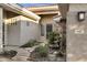 Inviting front entrance featuring a charming courtyard and a decorative fountain with mature landscaping at 645 W Longhorn Dr, Chandler, AZ 85286