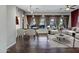 Bright living room with wood floors, large windows, dining table and comfortable seating area at 645 W Longhorn Dr, Chandler, AZ 85286