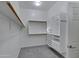 Bright walk-in closet provides ample storage with shelves and hanging space at 645 W Longhorn Dr, Chandler, AZ 85286