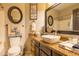 Bathroom with vessel sink, granite countertop, oval mirror and chrome faucet at 7027 W Blackhawk Dr, Glendale, AZ 85308