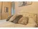 Up close shot of a comfortable, well-decorated bed with decorative pillows and soft bedding at 7027 W Blackhawk Dr, Glendale, AZ 85308