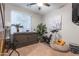 Cozy bedroom featuring a murphy bed and a comfortable sitting area with an exercise bike at 7027 W Blackhawk Dr, Glendale, AZ 85308