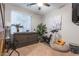 Cozy bedroom featuring a murphy bed, exercise bike, and a bright window at 7027 W Blackhawk Dr, Glendale, AZ 85308