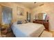 Inviting bedroom features a comfortable bed, soft lighting, and stylish décor at 7027 W Blackhawk Dr, Glendale, AZ 85308
