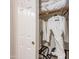 Walk-in closet equipped with metal hangers, storage rack, and white robes at 7027 W Blackhawk Dr, Glendale, AZ 85308