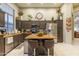 Spacious kitchen featuring an island with barstool seating and plenty of counter space at 7027 W Blackhawk Dr, Glendale, AZ 85308