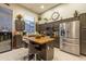 Modern kitchen with stainless steel appliances, a center island, and ample cabinet space at 7027 W Blackhawk Dr, Glendale, AZ 85308