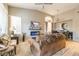 Inviting living room with fireplace, comfortable seating, and natural light creating a cozy atmosphere at 7027 W Blackhawk Dr, Glendale, AZ 85308