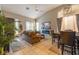 Open concept living room and dining area with neutral tones and modern decor at 7027 W Blackhawk Dr, Glendale, AZ 85308