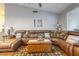 Comfortable living room with a leather sectional sofa and a patterned rug at 7027 W Blackhawk Dr, Glendale, AZ 85308