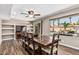 A spacious dining room features natural light, a wooden table and tiled flooring at 717 N Mckemy Ave, Chandler, AZ 85226