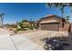 Single Gathering home showing lush garden, two-car garage and a large driveway at 717 N Mckemy Ave, Chandler, AZ 85226