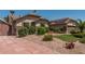 Landscaped front yard showing a stone-clad home with desert landscaping at 717 N Mckemy Ave, Chandler, AZ 85226