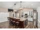 Gourmet kitchen featuring granite countertops, large island, stainless steel appliances, and modern lighting at 717 N Mckemy Ave, Chandler, AZ 85226
