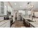 Gourmet kitchen featuring granite countertops, stainless steel appliances, and modern lighting at 717 N Mckemy Ave, Chandler, AZ 85226
