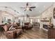 Open-concept living area with fireplace, wood floors and seating at 717 N Mckemy Ave, Chandler, AZ 85226