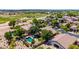 Aerial view showcasing a home with a sparkling pool, mature trees and desert landscaping at 723 E Gemini Pl, Chandler, AZ 85249